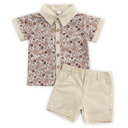 Close-up of matching floral print fabric on baby romper and toddler dress for siblings, summer