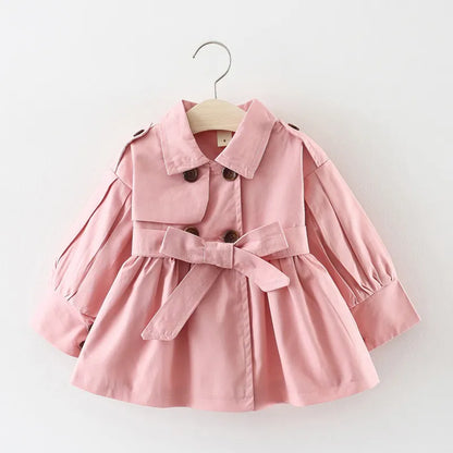 Toddler girl in a stylish broadcloth cotton trench coat, ideal for autumn jacket.
