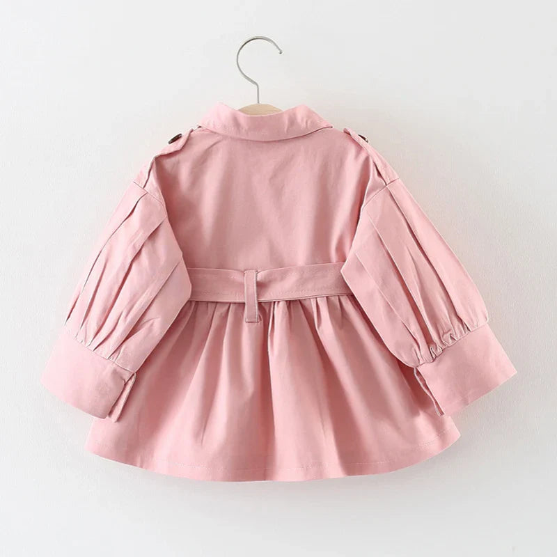 Girls' pink cotton trench coat, perfect for toddler outerwear and spring adventures.