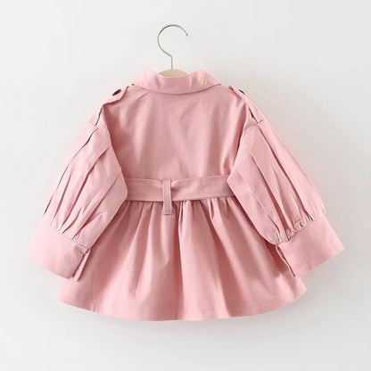 Girls' pink cotton trench coat, perfect for toddler outerwear and spring adventures.