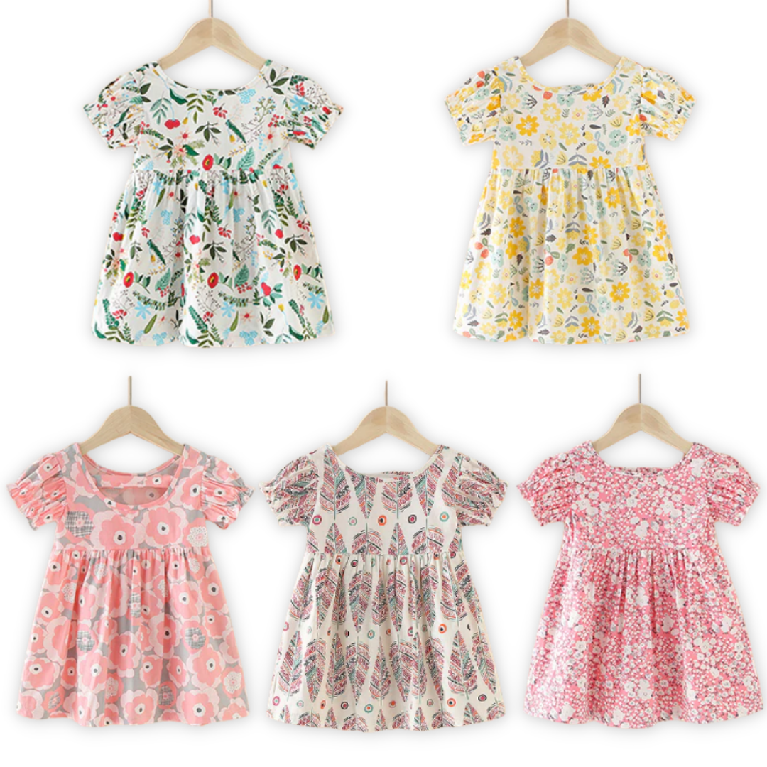 Close-up of the nature pattern and puff sleeves on a cute girls cotton sundress.