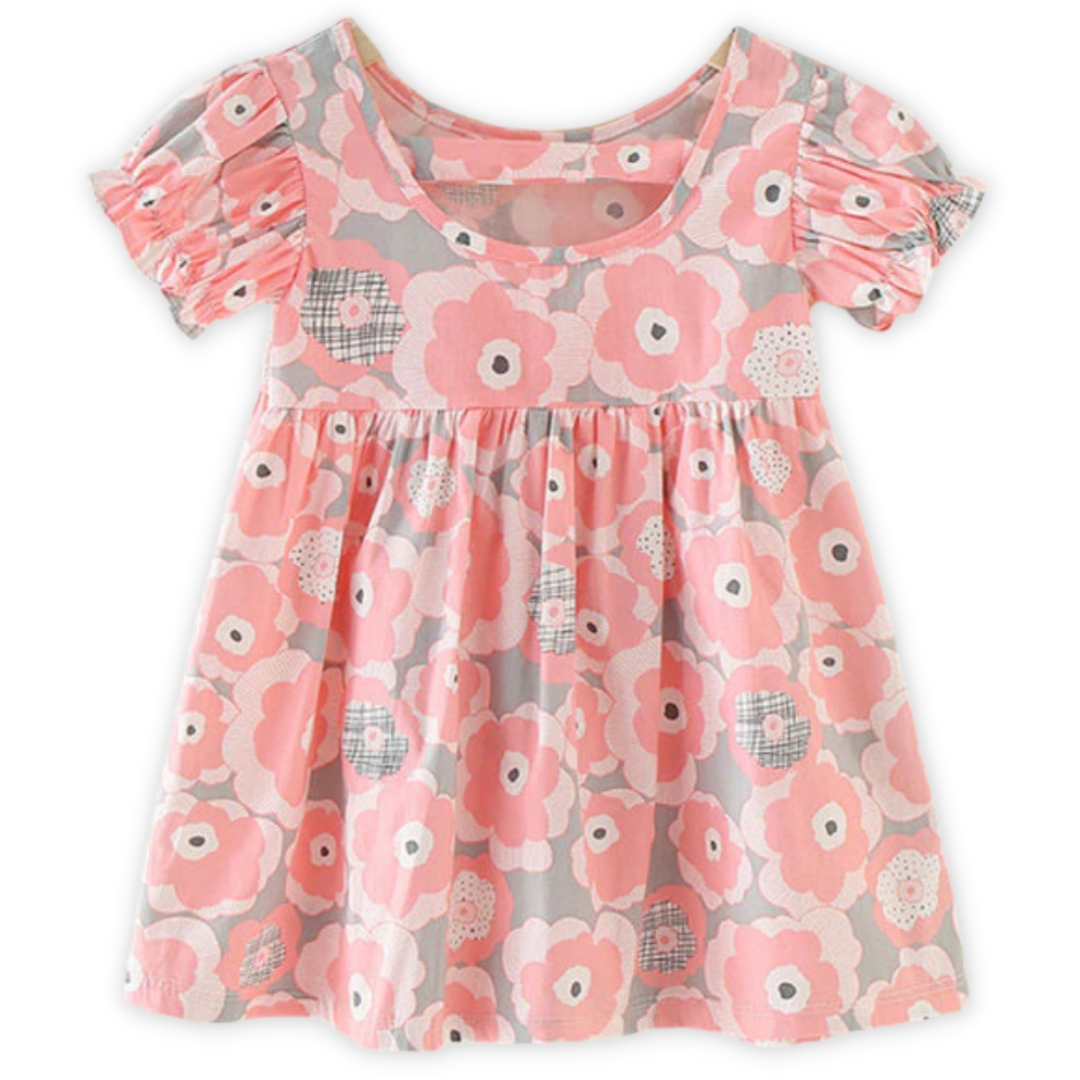 Back view of a baby girl's puff sleeve sundress with a cheerful nature print.