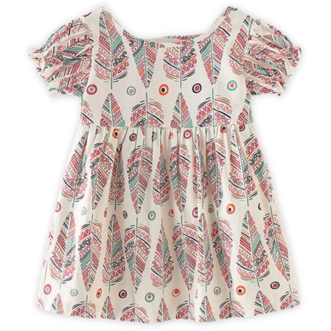 Kids fashion: close-up of the soft cotton fabric and nature pattern on a summer dress.