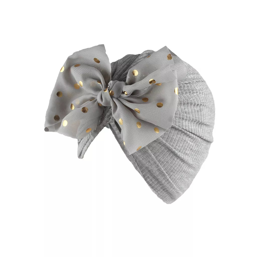 Infant headwear: shiny yellow bowknot turban hat for baby girls, soft material.