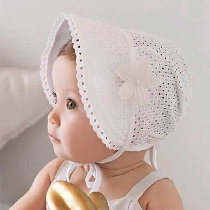Infant headwear: a durable white lace flower sun hat, designed for comfort and sun blockage.