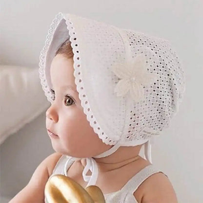 Infant headwear: a durable white lace flower sun hat, designed for comfort and sun blockage.