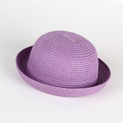 Toddler girl's wide brim straw sun hat, natural woven material, ideal for beach and outdoor play.