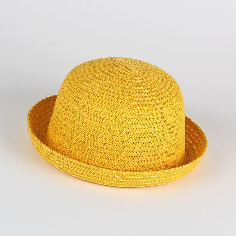 Fashionable baby girl's straw sun hat with a wide brim, designed for ultimate sun safety.