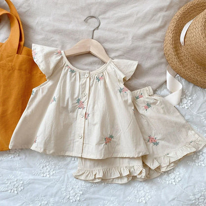 Baby girl wearing floral print flying sleeve top and matching shorts set, perfect for summer casual wear.
