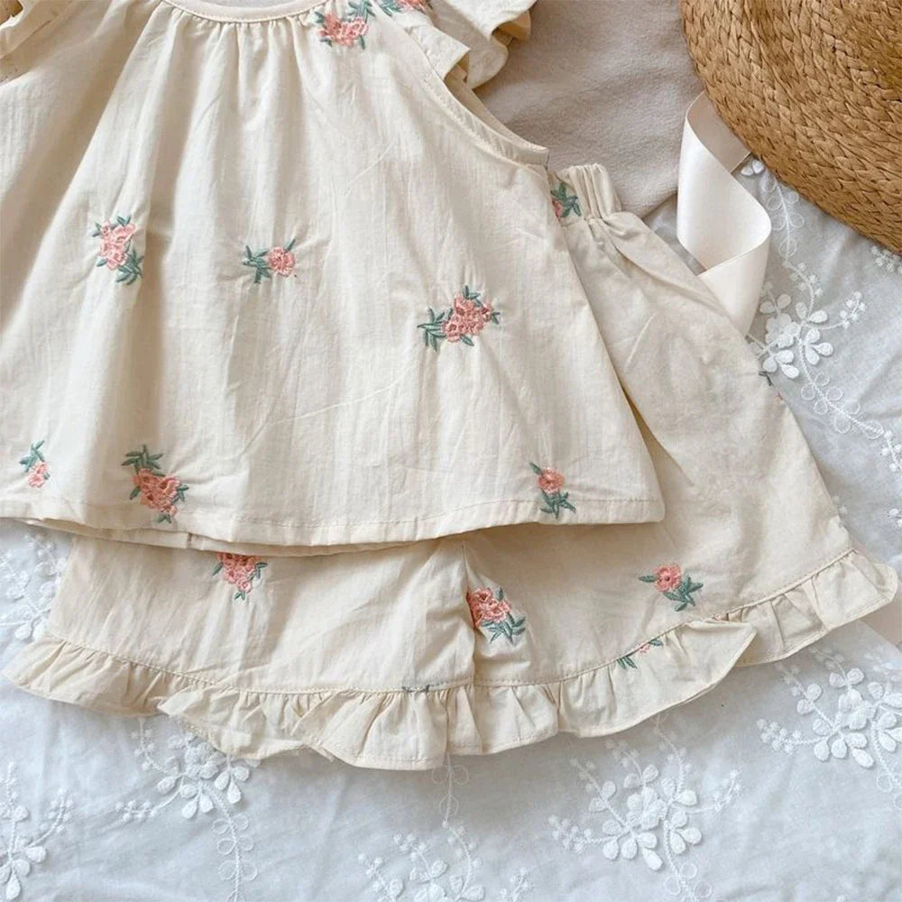 Stylish girls' floral print flying sleeve top and shorts set, perfect for any casual summer occasion.