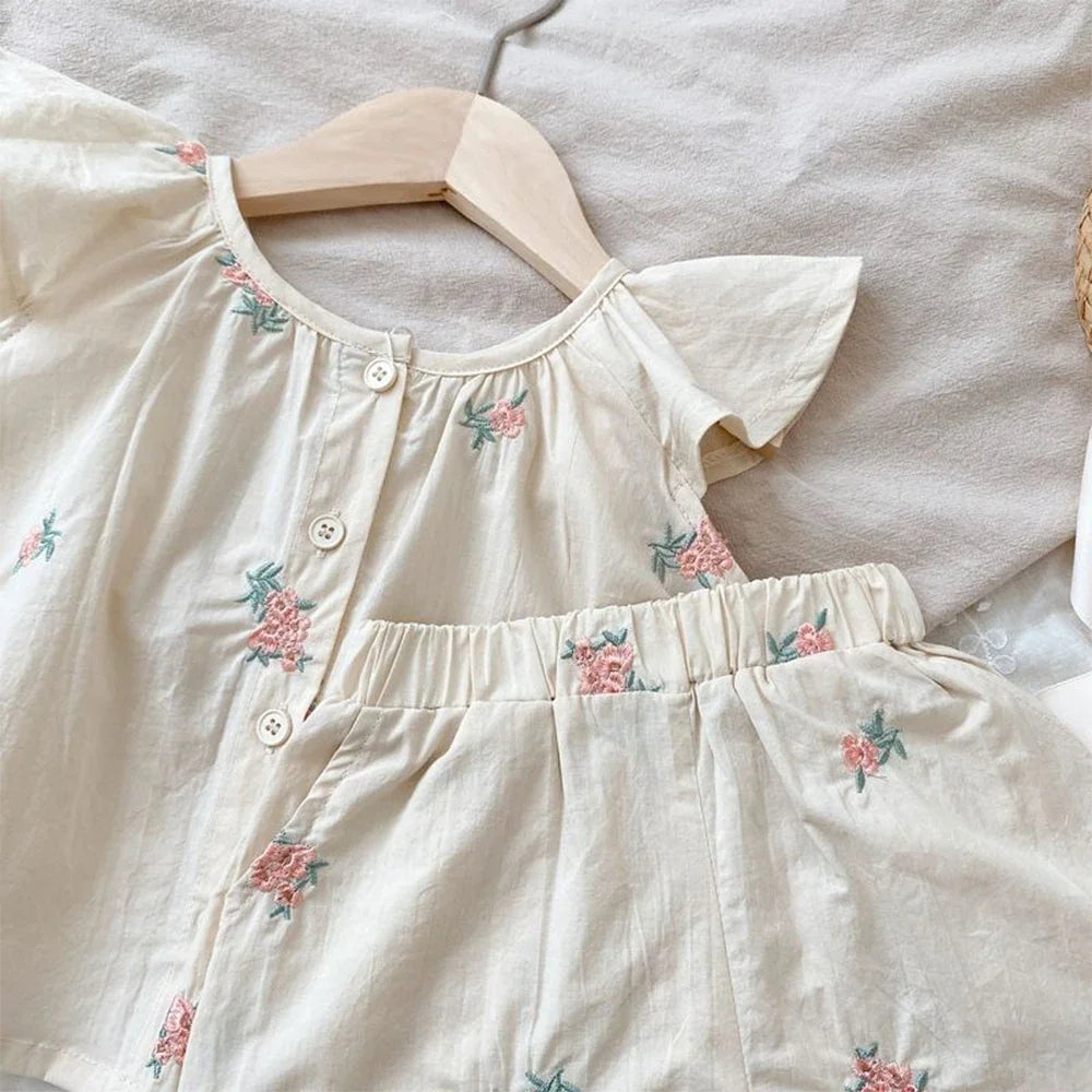Toddler girl's floral print flying sleeve top with comfortable elastic neckline and cotton fabric.
