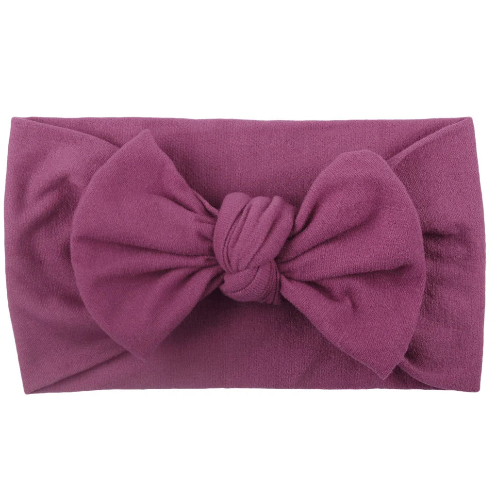Collection of colorful baby elastic bowknot headbands, newborn accessories.