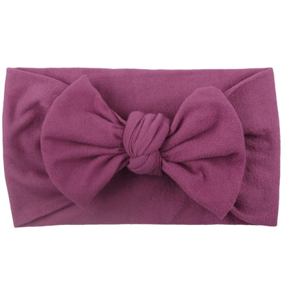 Collection of colorful baby elastic bowknot headbands, newborn accessories.