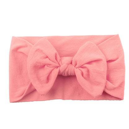 Different styles of bowknot headbands for baby girls, soft and elastic for newborns.