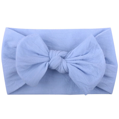 Arrangement of baby girl bowknot headbands, various sizes, elastic and soft for infants.