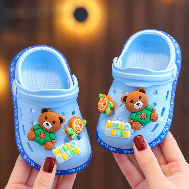 Pair of blue non-slip soft sandals for baby boys, ideal for waterproof outdoor toddler footwear.