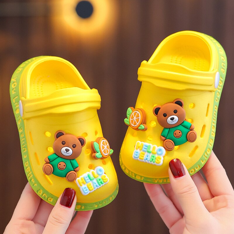 Adorable baby feet in yellow non-slip sandals, perfect for comfortable summer kids footwear.