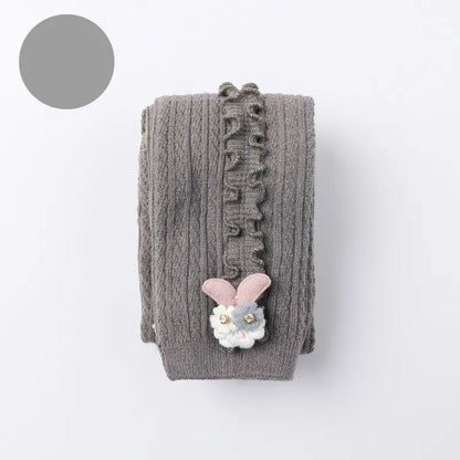 Girl's cozy cotton ribbed tights in a neutral grey, versatile for any baby outfit.
