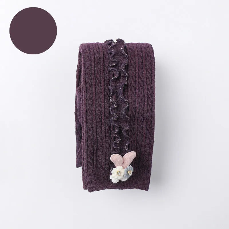 Toddler model showcasing the comfortable stretch of ribbed cotton tights, kids clothing.