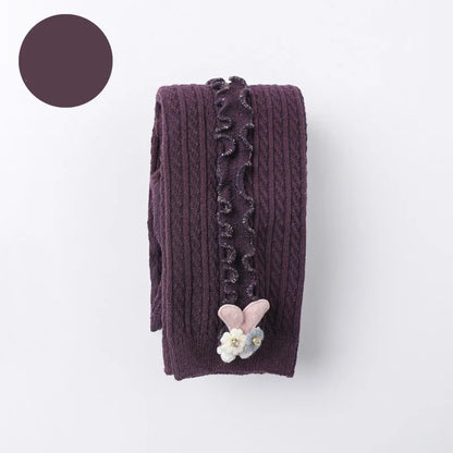 Display of ribbed cotton tights in various sizes, from newborn to toddler, warm legwear.