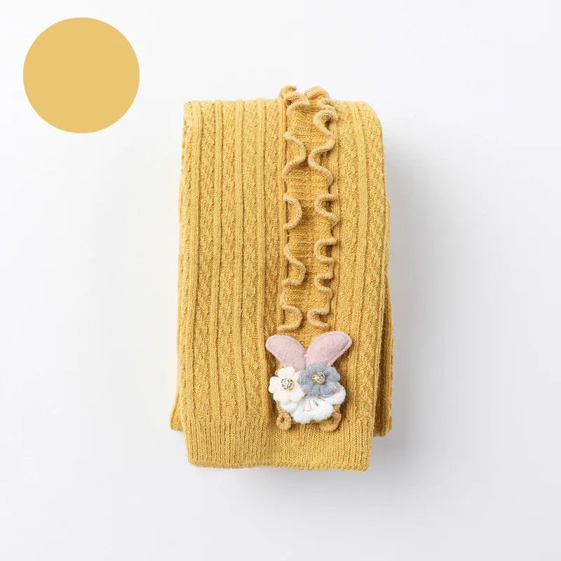 Close up of elastic waistband on soft white ribbed cotton tights for baby girls.