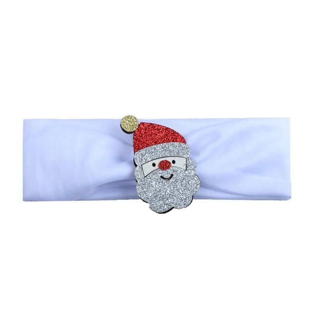Festive hairband for baby girls, featuring a cute Santa Claus figure on a red headband