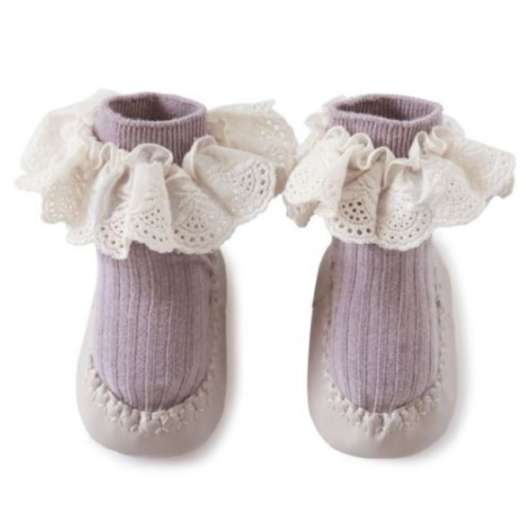 Soft white cotton baby walker shoes with lace design and anti-slip sole for toddlers.