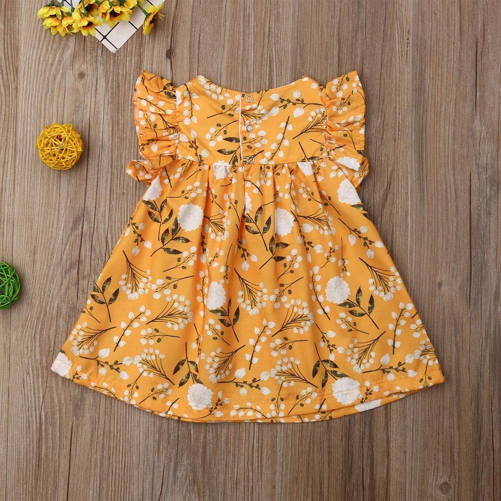 Adorable baby girl yellow floral dress with frill neck and sleeveless design, perfect toddler fashion.