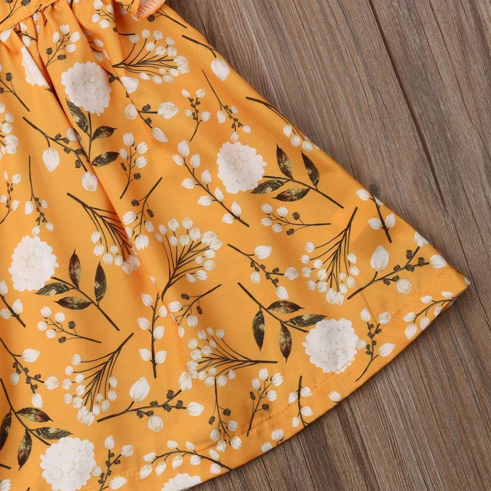 Yellow floral frill sleeveless frock for baby girls, a comfortable cotton dress for warm weather.