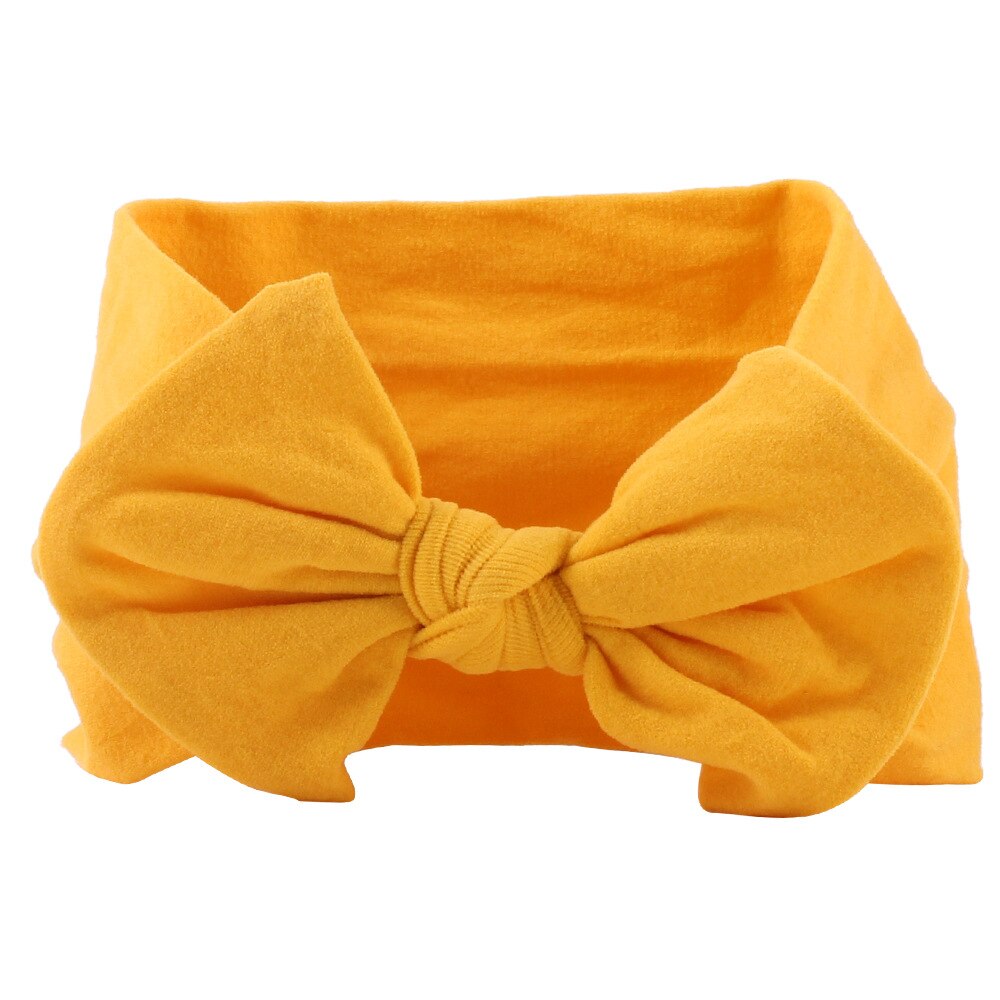 Display of multi-colored soft elastic headbands and bows for baby girls, comfortable and gentle
