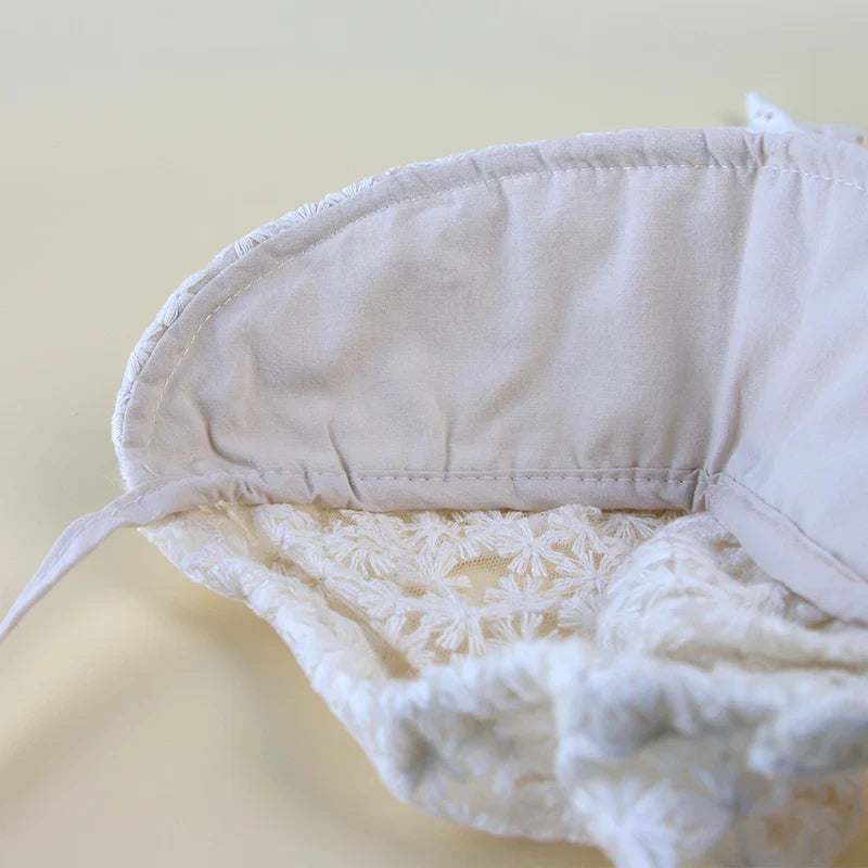 Infant sun cap for baby girls, showcasing beautiful lace flowers and offering sun protection