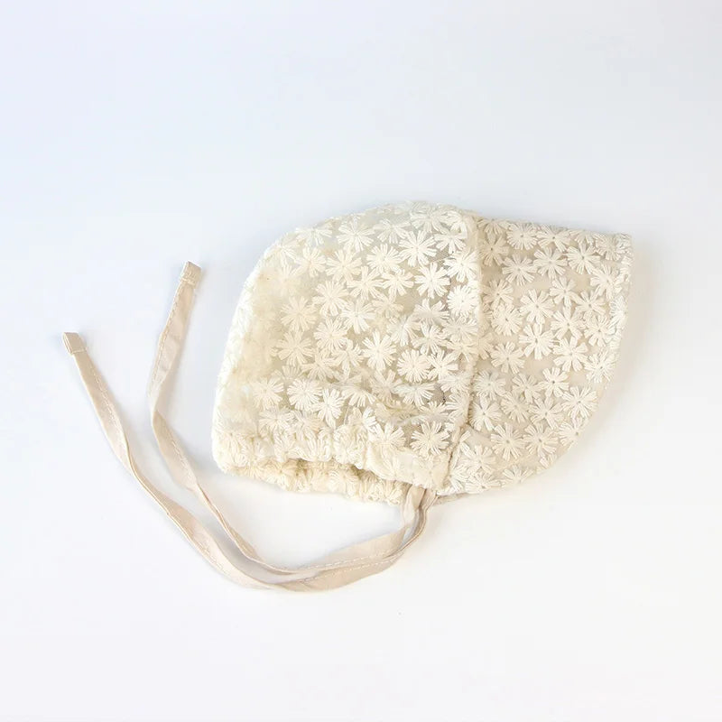 Baby accessories: a stylish beige lace flower sun hat, essential for newborn sun protection