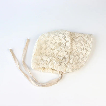 Baby accessories: a stylish beige lace flower sun hat, essential for newborn sun protection