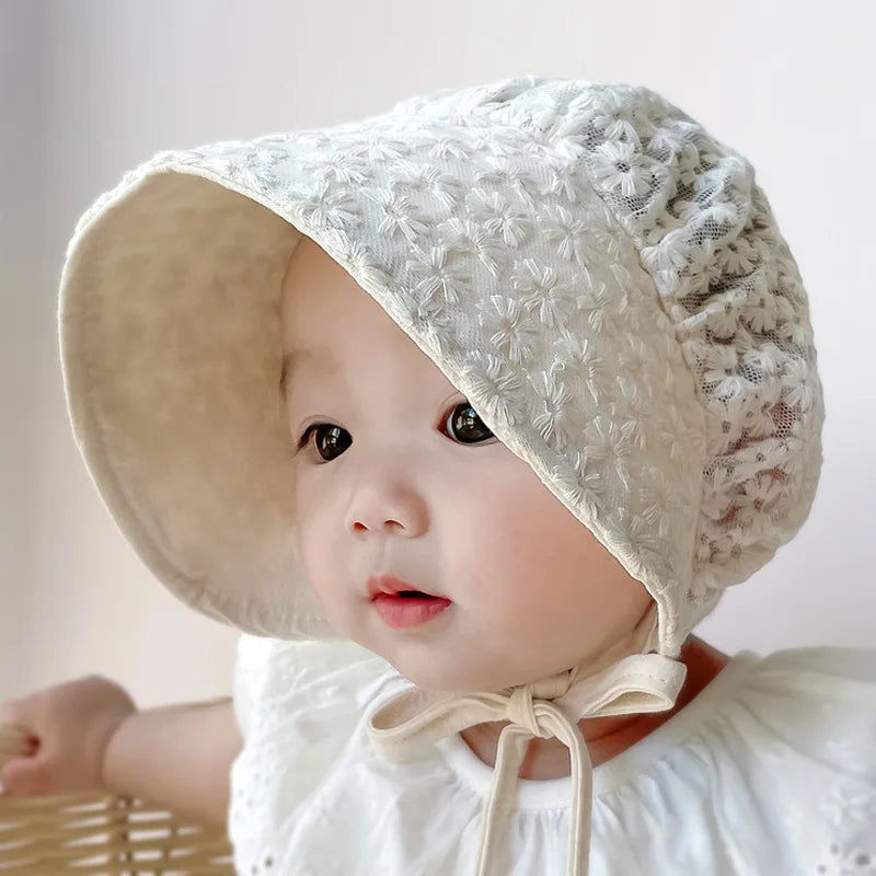 Baby girls summer hat with a charming lace flower pattern, designed for comfort and sun safety