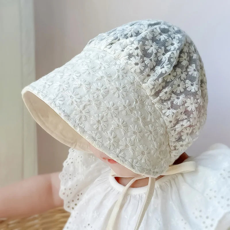 Polyester baby hat for girls, beige with delicate lace flowers, providing excellent sun protection