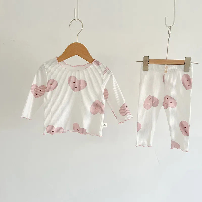 Baby girl's essential indoor wear: dot print cotton sleeper set, easy snap closures