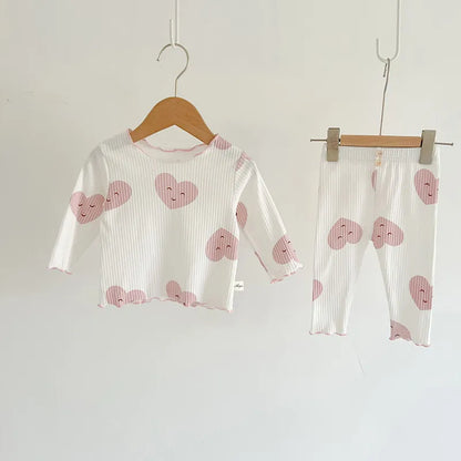 Baby girl's essential indoor wear: dot print cotton sleeper set, easy snap closures
