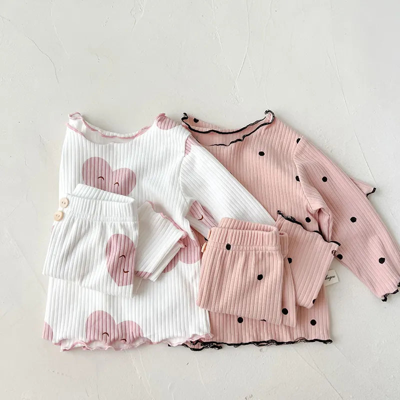 Cotton sleeper set for baby girls, featuring a charming dot print on a pastel background