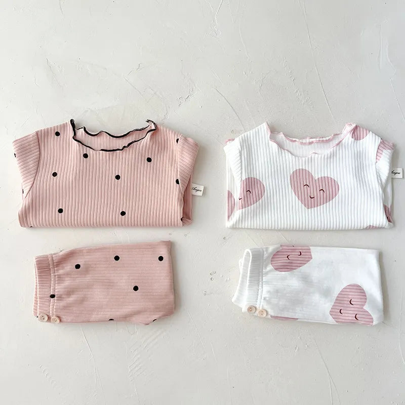Baby girl's versatile dot print cotton sleeper set, suitable for sleeping or lounging