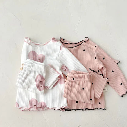 Unisex baby cotton sleeper set with playful dot print, ideal for soft indoor wear