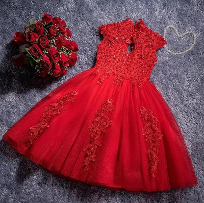 Stylish baby girl's party dress featuring delicate lace and shimmering sequin details