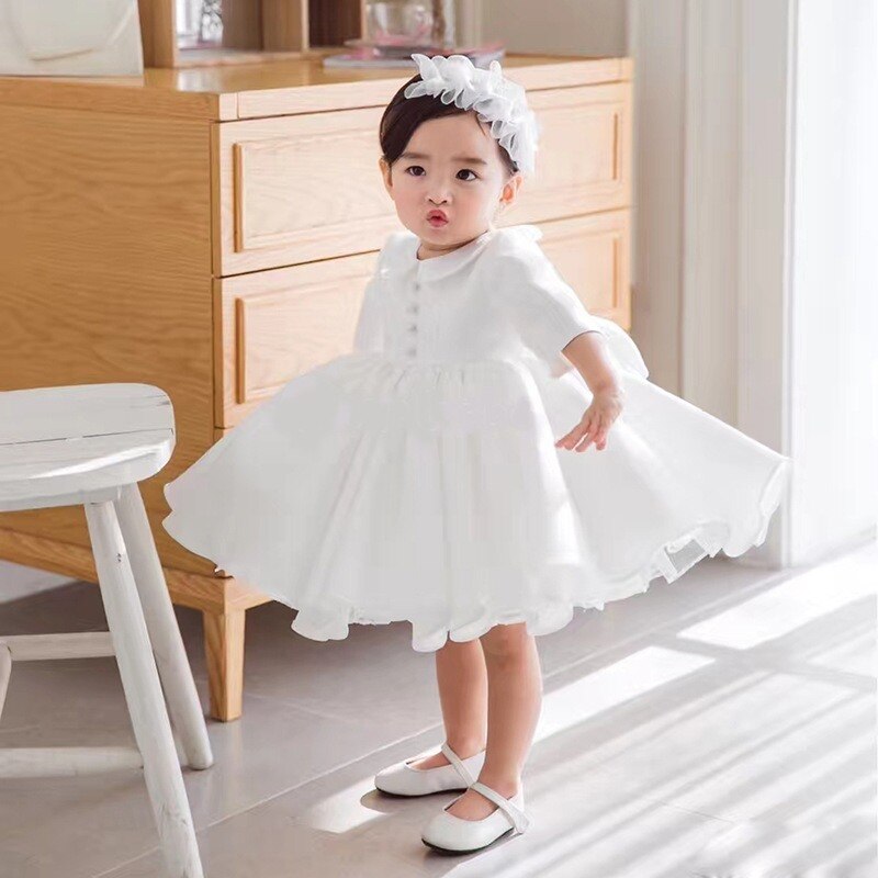 Toddler girls' christening gown in white, long sleeve, showcasing elegant design and comfortable cotton fabric.