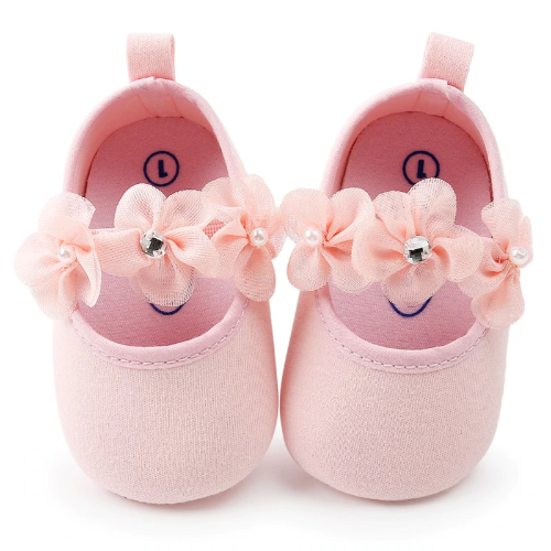 Close-up of pink floral cotton baby shoes with elastic ankle and matching floral headband set