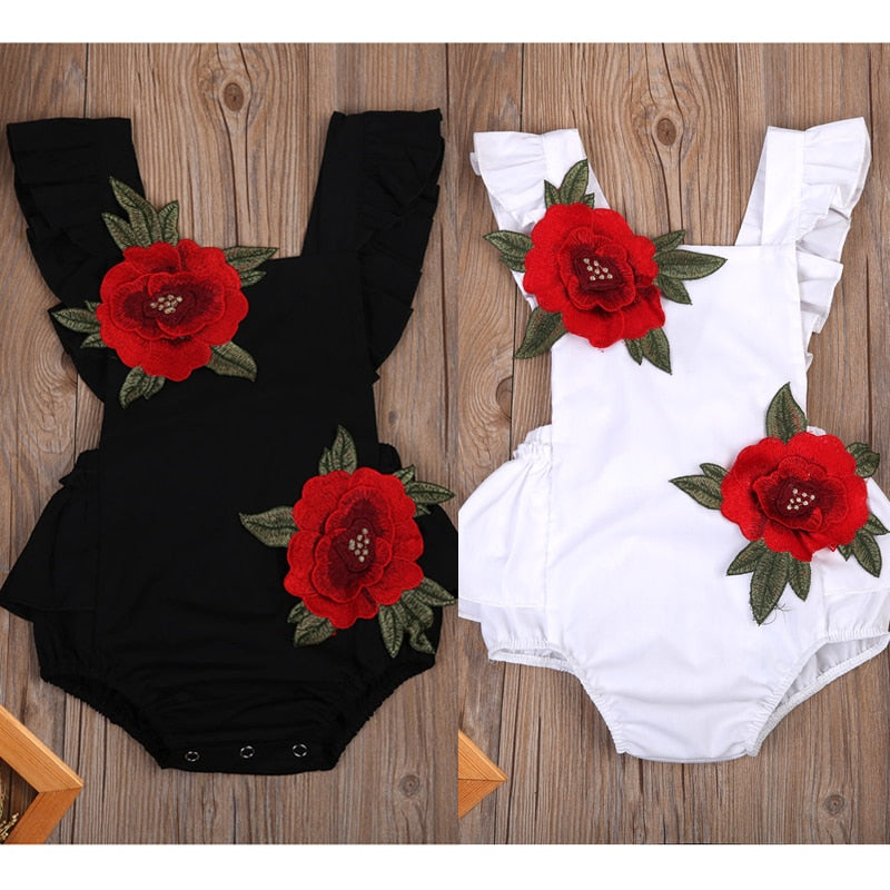 Baby girls' floral cotton romper bodysuit in pink, perfect for summer.