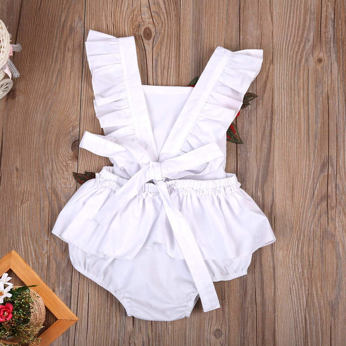 Adorable baby girl's floral print cotton romper, great for a summer outfit.