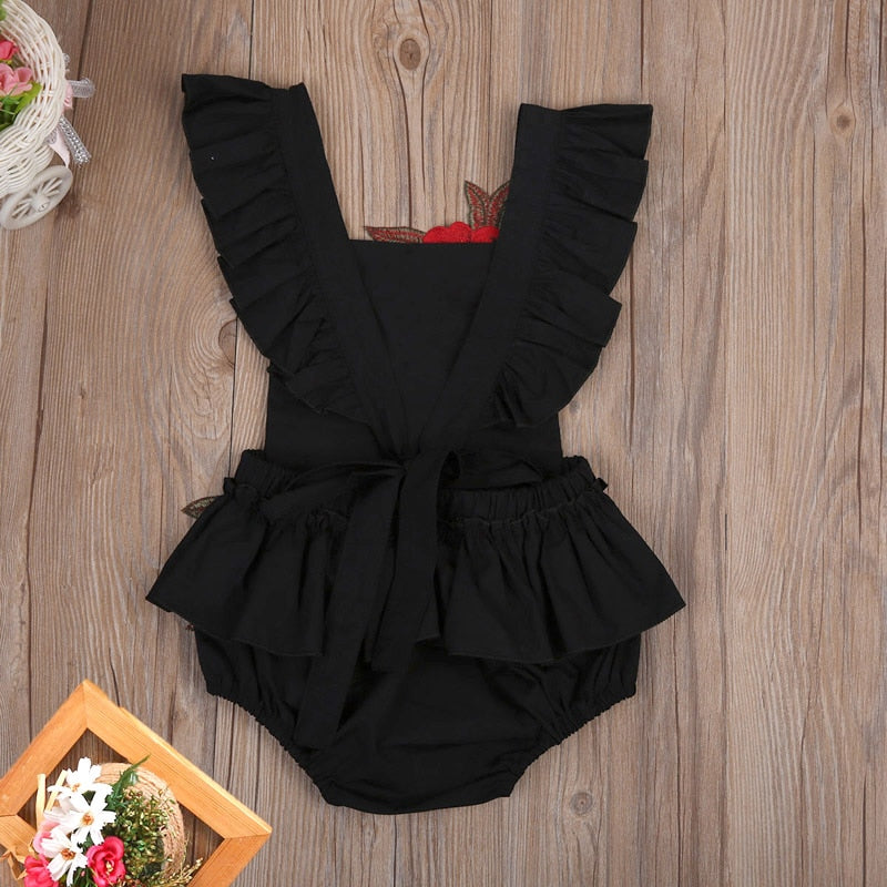 Soft cotton baby girls' bodysuit featuring a sweet floral pattern, a perfect gift.