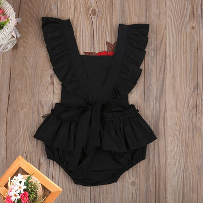 Soft cotton baby girls' bodysuit featuring a sweet floral pattern, a perfect gift.