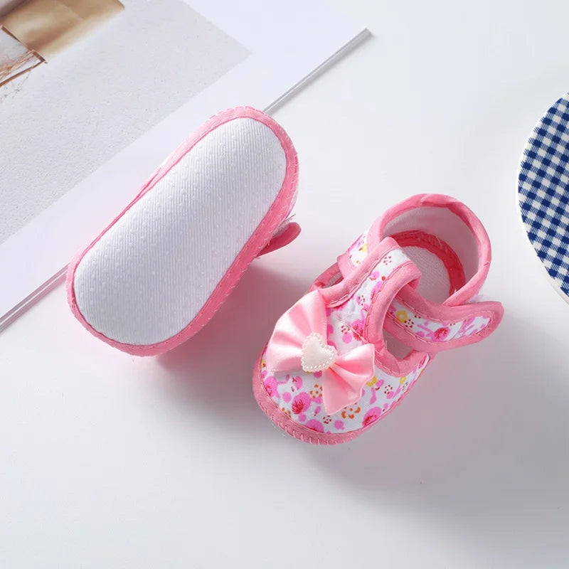Soft sole non-slip baby girl shoes, first walkers, featuring a cute bow and adjustable hook loop strap