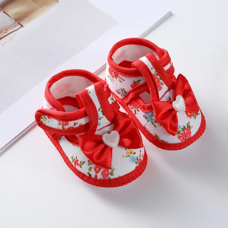 Infant footwear: baby girl first walker shoes, non-slip, pink, with a gentle soft sole and bow tie