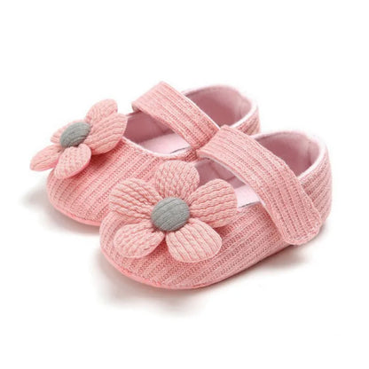Purple infant girl anti-slip sneakers, soft sole with a decorative bow on the front.